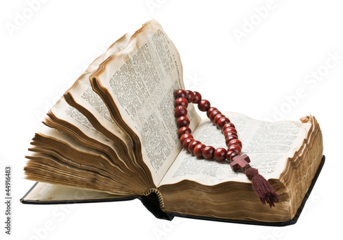 open bible and wooden rosary photo
