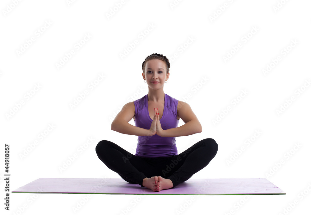 young woman sit in lotos as yoga asana on mat young woman sit in lotos as yoga asana on mat