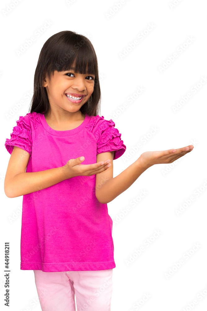 Smiling asian little girl showing empty copyspace on open hand Smiling asian little girl showing empty copyspace on open hand