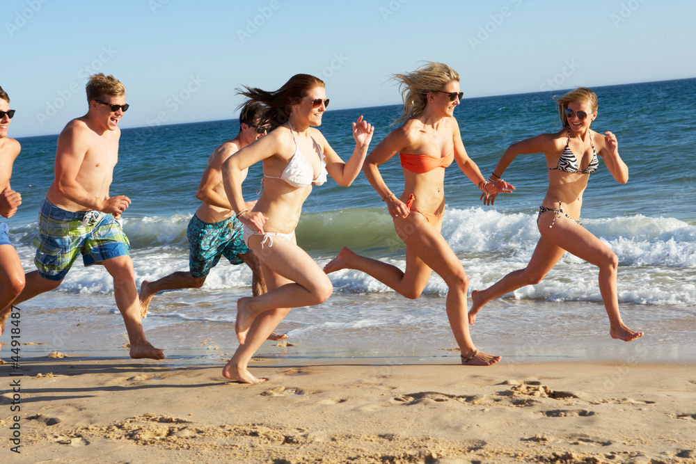 Group Of Teenage Friends Enjoying Beach Holiday Together Group Of Teenage Friends Enjoying Beach Holiday Together