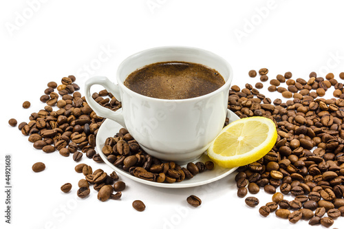 Cup of coffee with lemon and grains