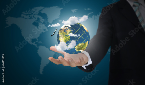 Hand of business man holding earth globe