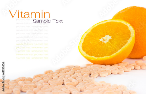 Vtamin c tablet with orange fruit on white background photo