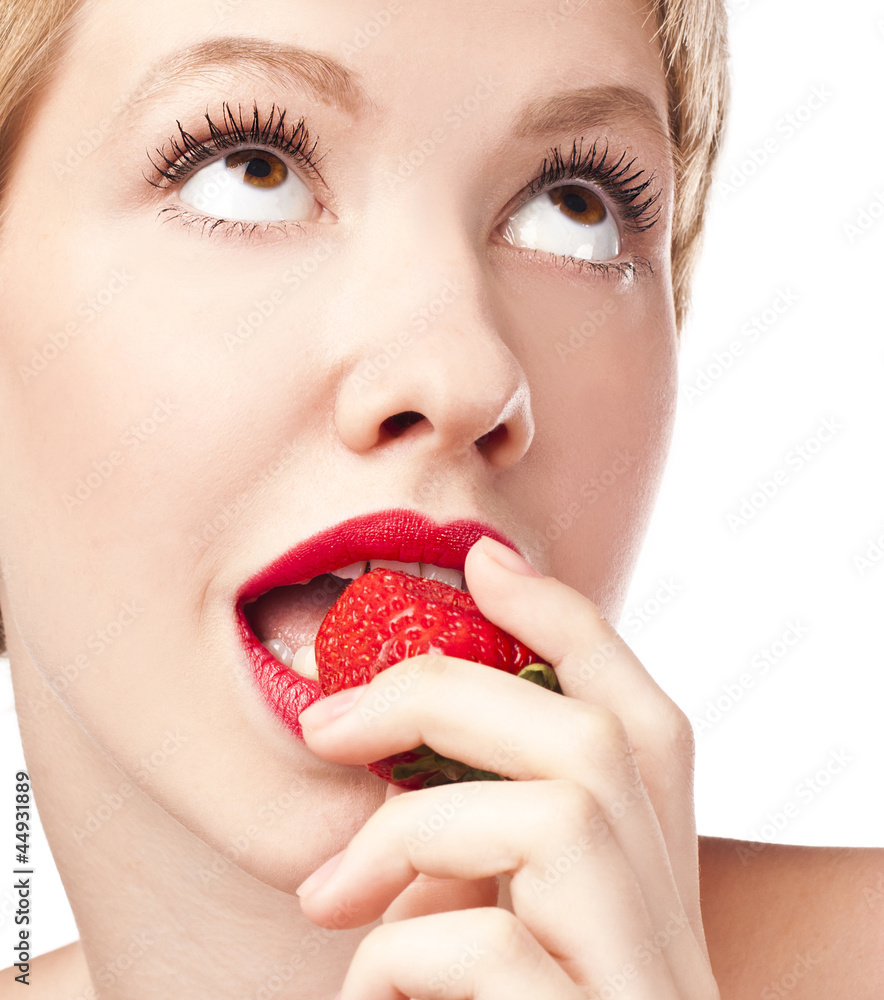 The blonde in the studio with strawberries. red lips The blonde in the studio with strawberries. red lips