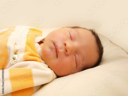 Newborn baby, infant, sleeping in it's bed