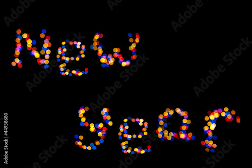 blurred colorful circles bokeh of Christmaslight "New Year"