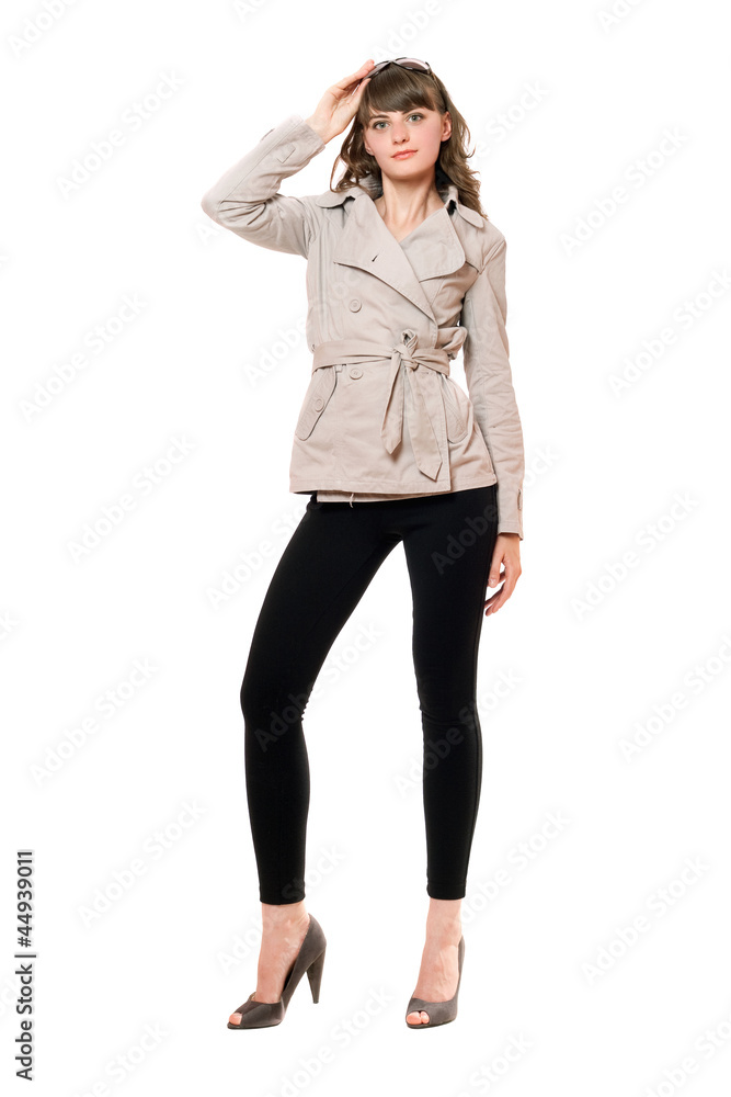 Lovely girl wearing a coat and black leggings. Isolated Lovely girl wearing a coat and black leggings. Isolated