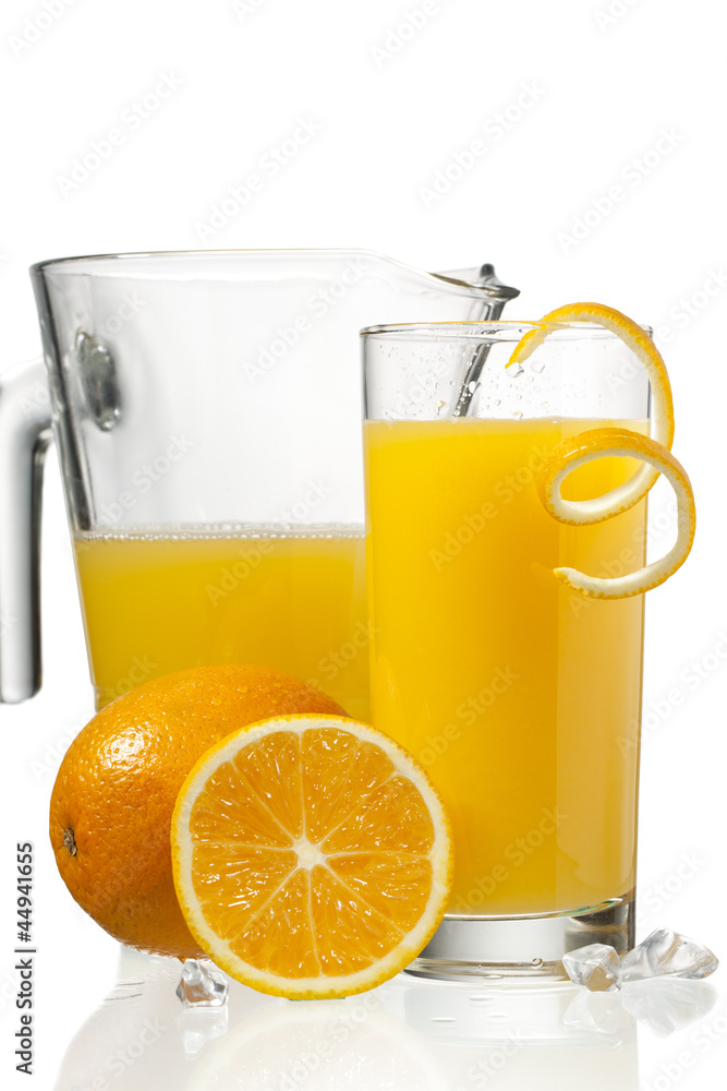 orange juice in glass and a jar orange juice in glass and a jar