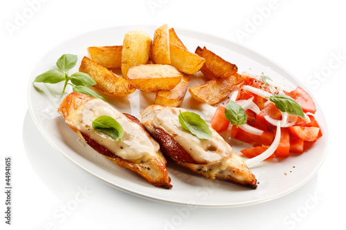 Grilled chicken breasts with cheese and baked potatoes