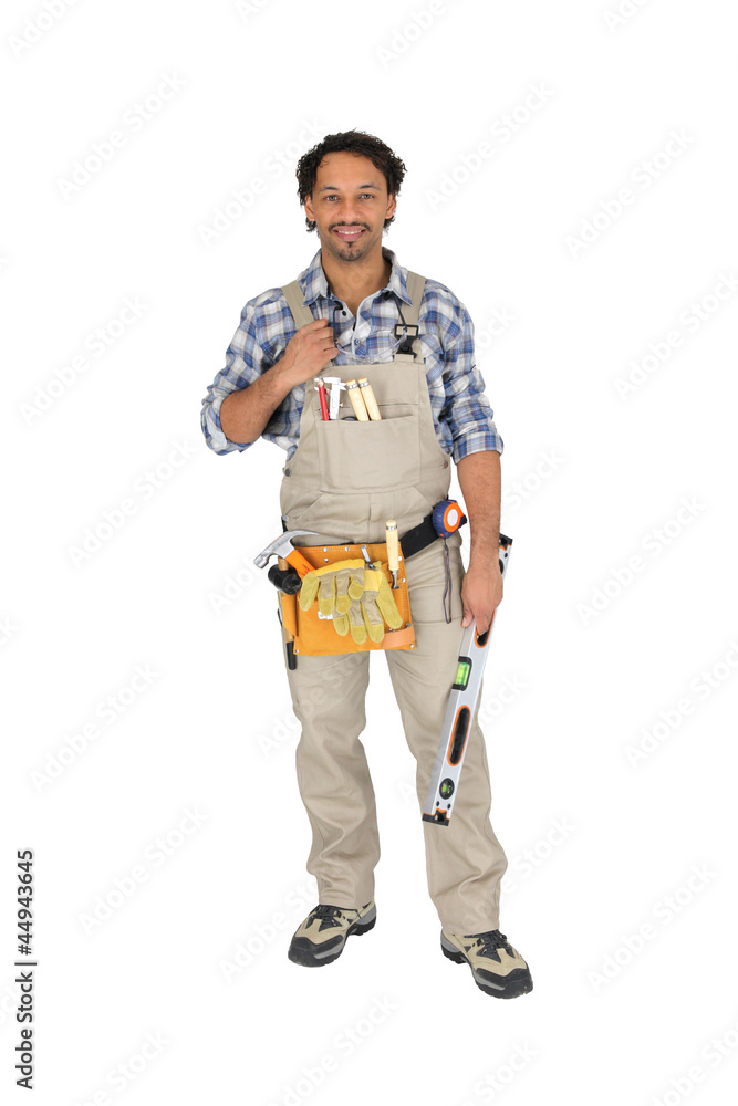 Carpenter posing with spirit level Carpenter posing with spirit level