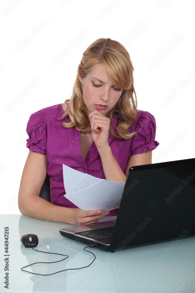 Secretary reviewing paperwork Secretary reviewing paperwork