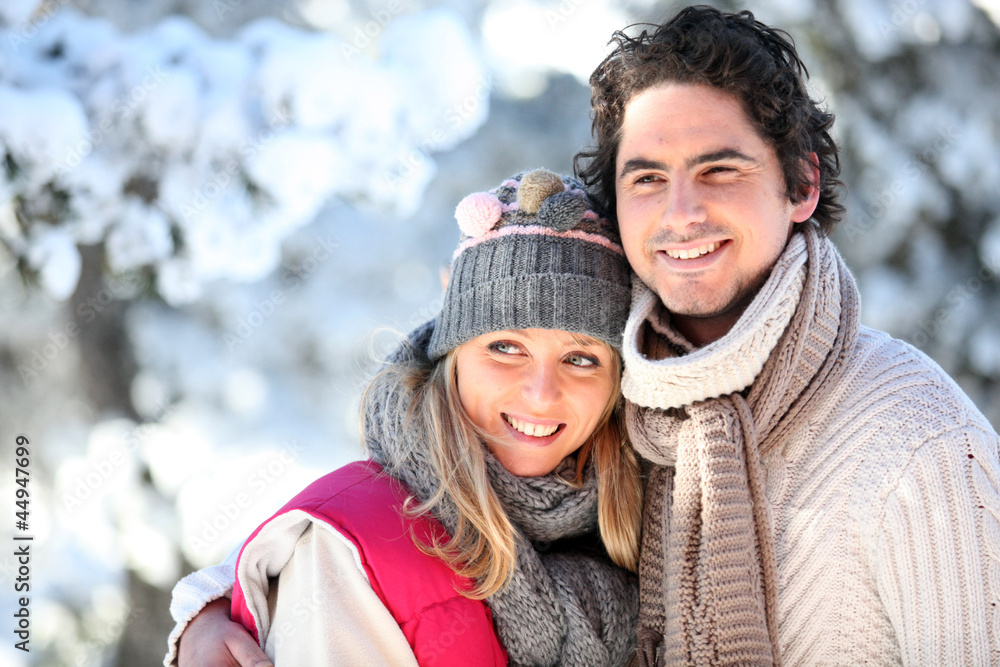 portrait of happy couple at winter resort portrait of happy couple at winter resort
