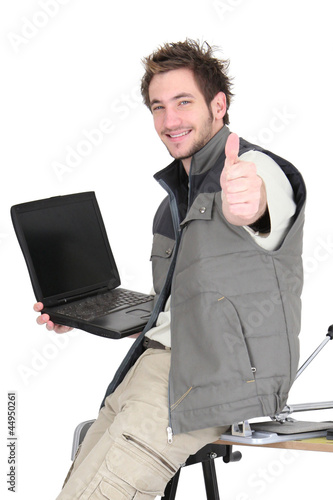 Tiler with a laptop photo