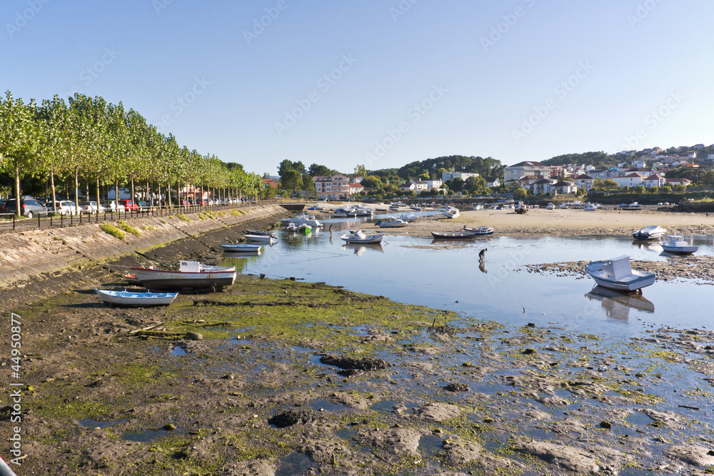 Boats stranded at low tideo on the estuary of Esteiro