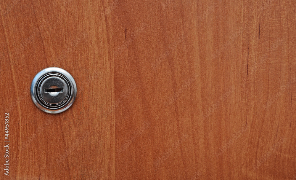 Fototapeta premium key hole of office wooden cabinet