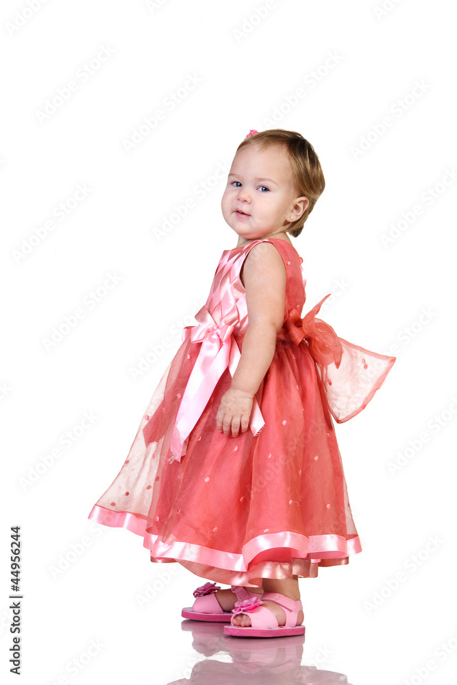 Baby in an elegant pink dress. isolated on white Baby in an elegant pink dress. isolated on white