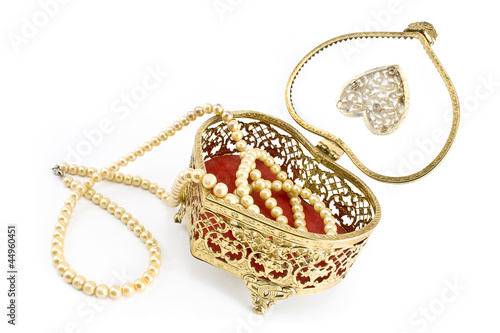 Golden jewelry box with pearl necklace