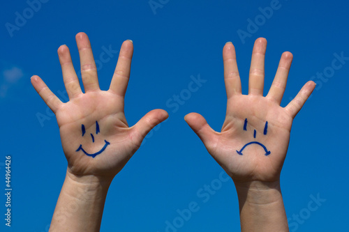 Hands with smiles and sadness pattern