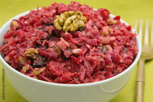 Salad with beets, dried plums, nuts