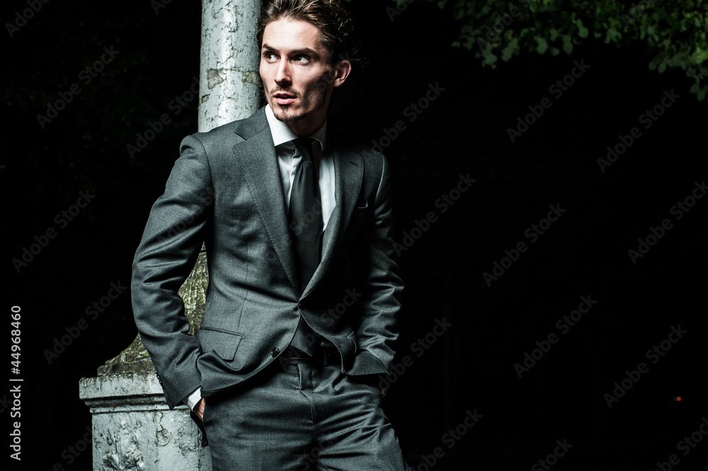 Fototapeta premium guy walking night after meeting business