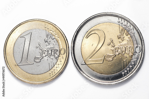 A one and a two euros coins isolated on a white background