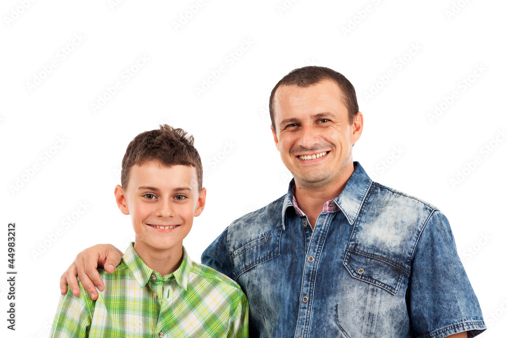 Father and son posing together in studio Father and son posing together in studio