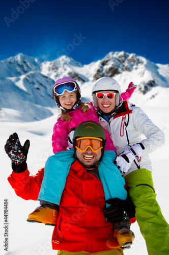 Skiing, winter fun - happy family ski team