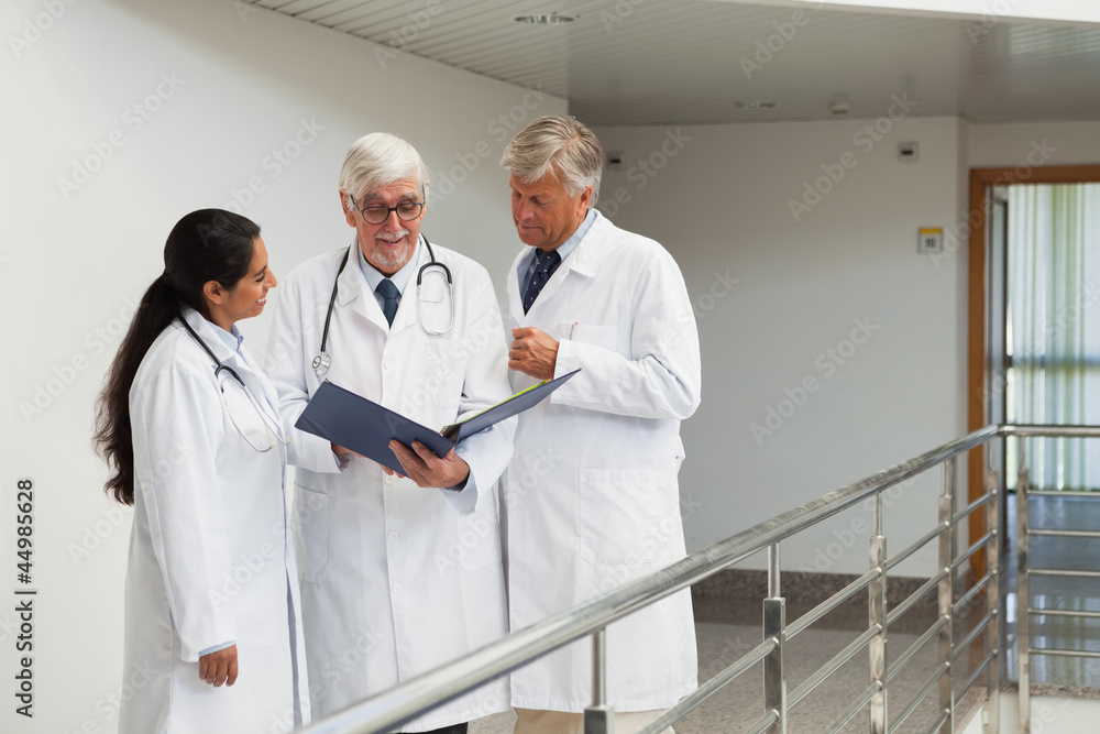 Three doctors talking