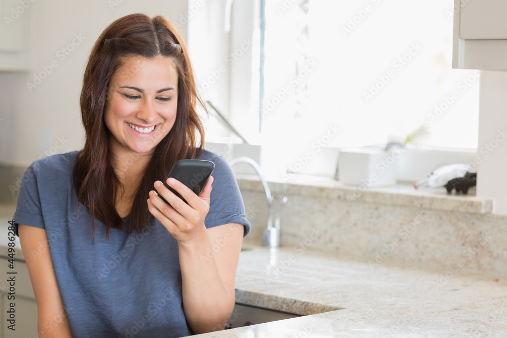 Woman smiling while calling her friend Woman smiling while calling her friend