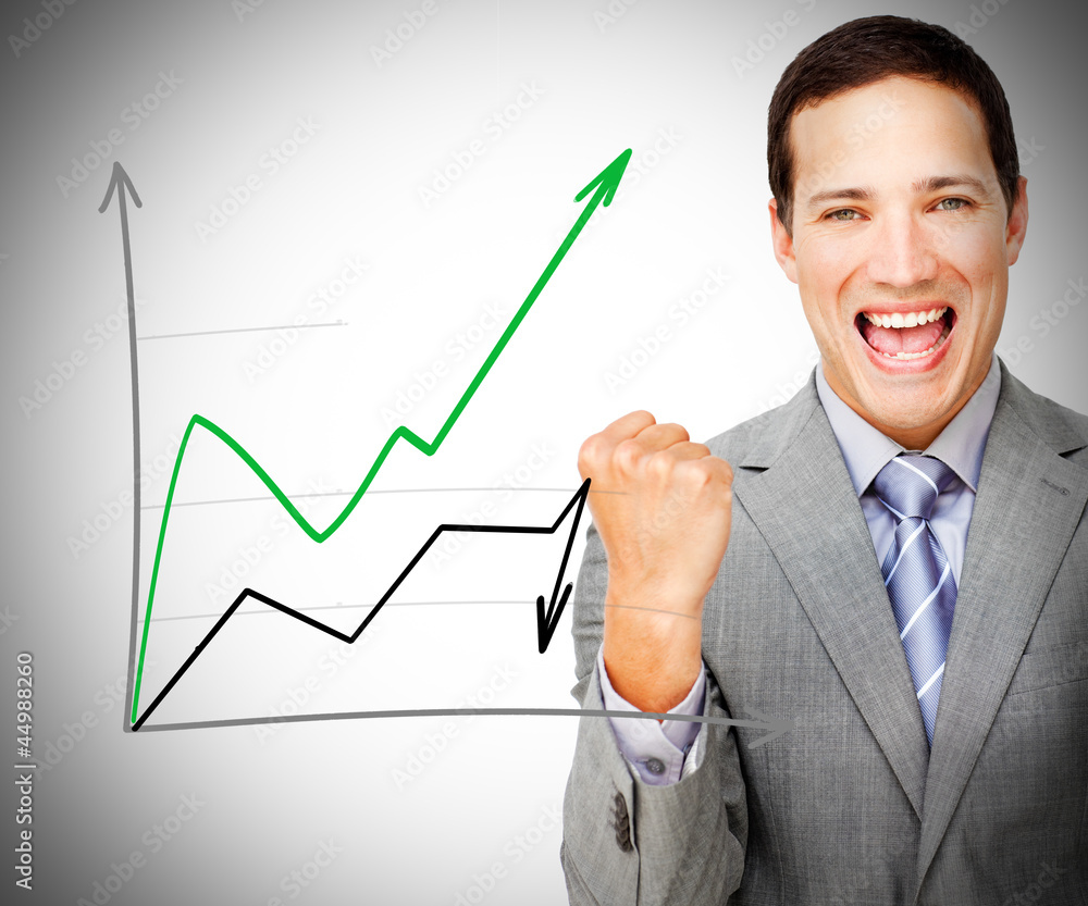 Businessman standing smiling behind graph Businessman standing smiling behind graph