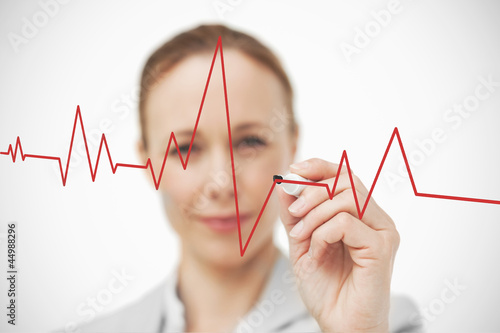 Woman drawing ECG line