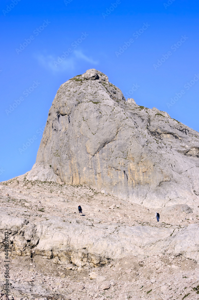 Two climbers in the mountains among the rocks Two climbers in the mountains among the rocks