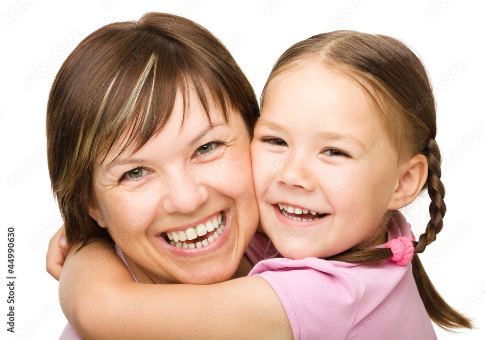Portrait of a happy mother hugging her daughter Portrait of a happy mother hugging her daughter