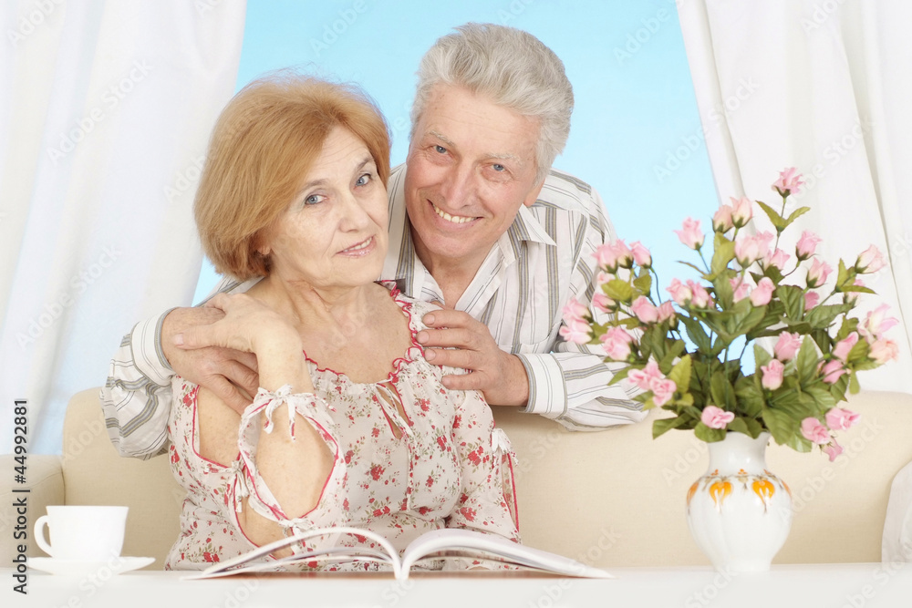 Beautiful elderly couple resting at home