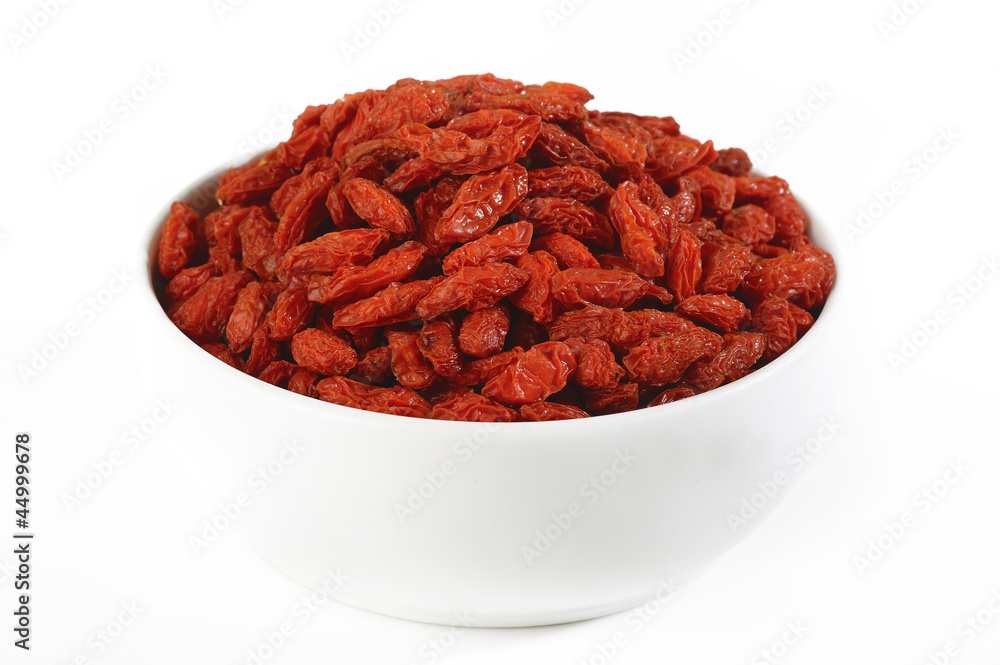 goji berries in white bowl isolated on white background goji berries in white bowl isolated on white background