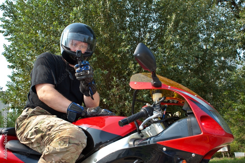 assassin on a motorcycle fired from a gun assassin on a motorcycle fired from a gun