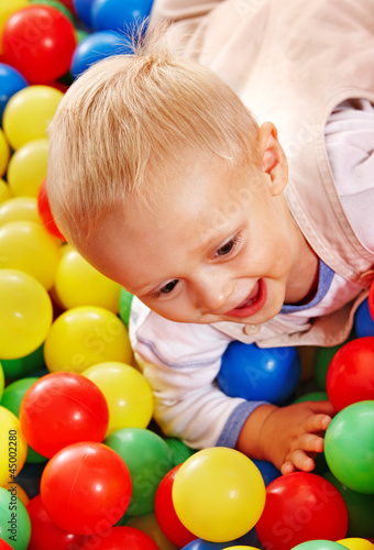 Child in colored ball.