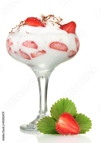 glass of ripe strawberries with cream isolated on white photo