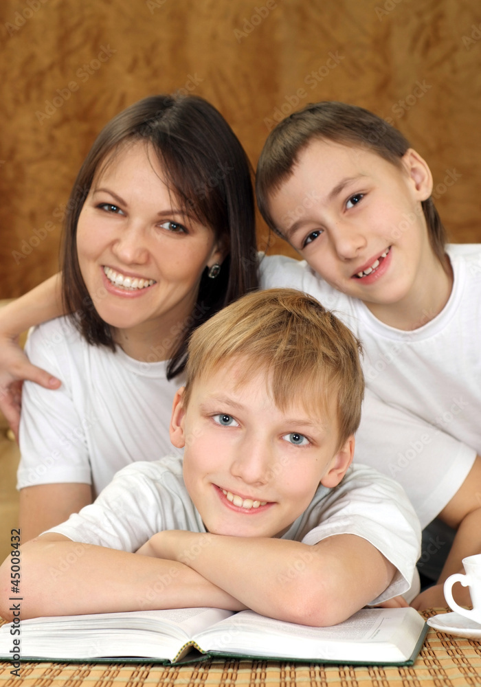 Joy charming mom and sons sitting