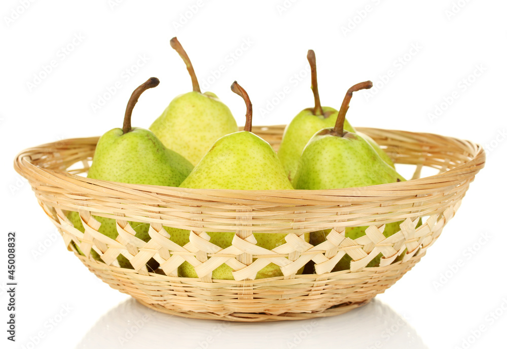 Ripe pears in wicker basket isolated on white