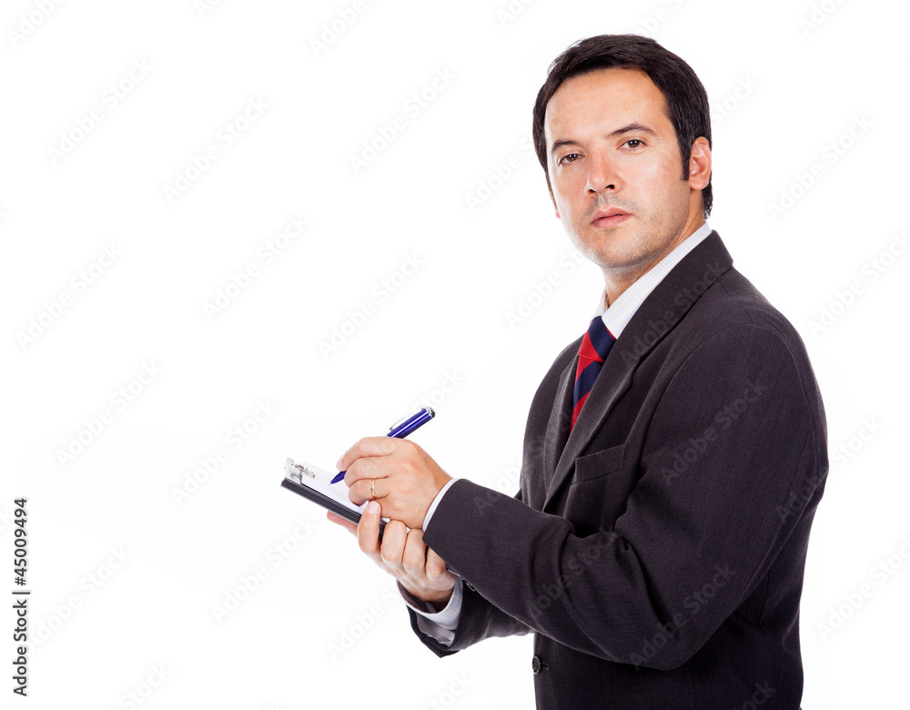 Smiling businessman holding a clipboard isolated on white backgr Smiling businessman holding a clipboard isolated on white backgr