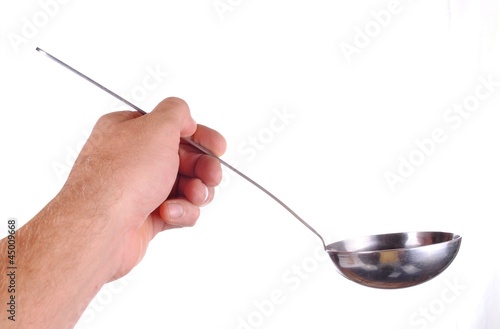 hand holds a soup ladle, isolated on white
