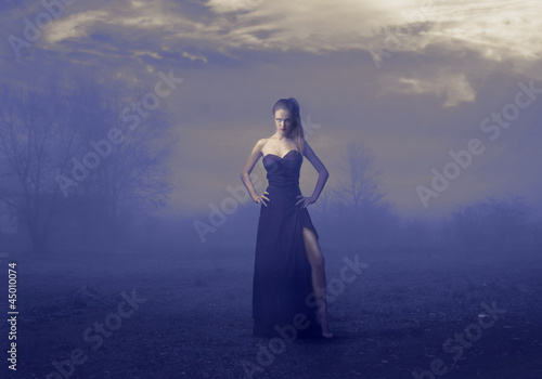 Elegant Girl in Black in a Desolate and Dreary Land