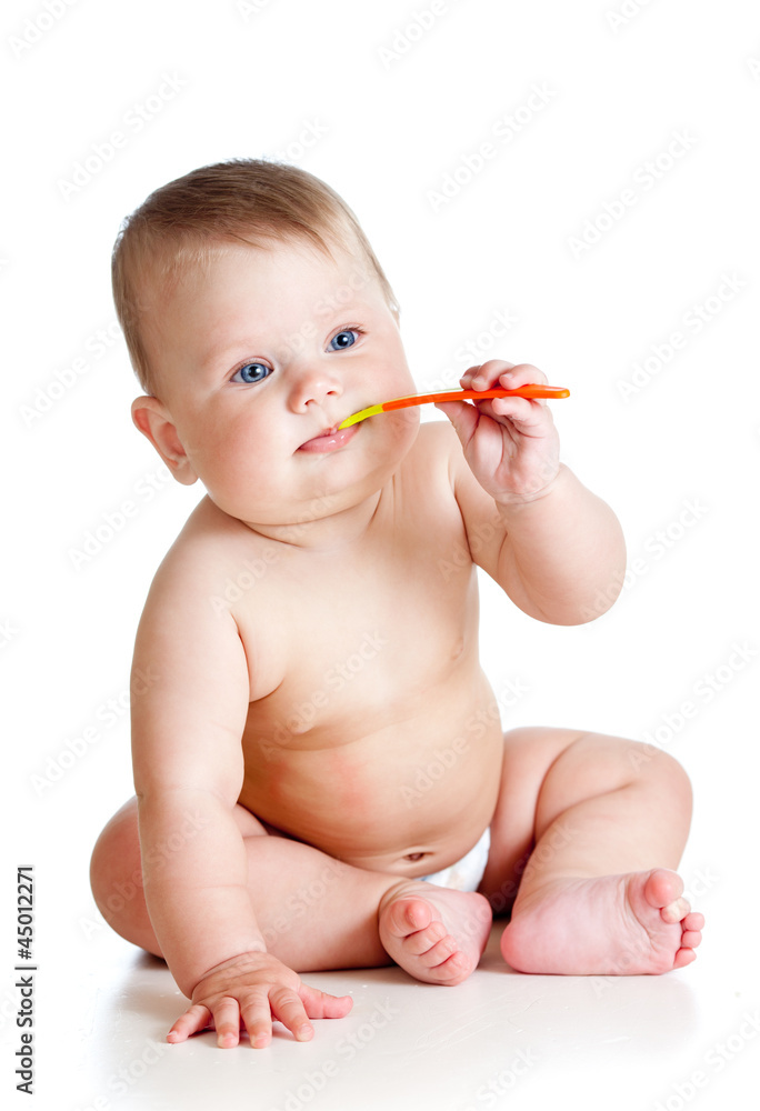 little baby brushing gums over white background little baby brushing gums over white background