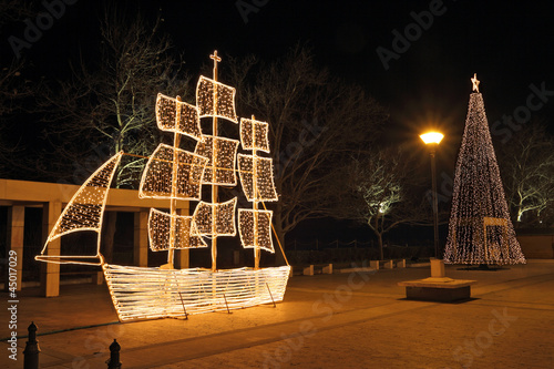 Christmas ship and tree at night, in Greece