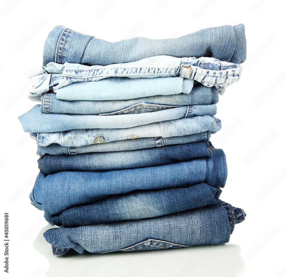 Lot of different blue jeans isolated on white Lot of different blue jeans isolated on white