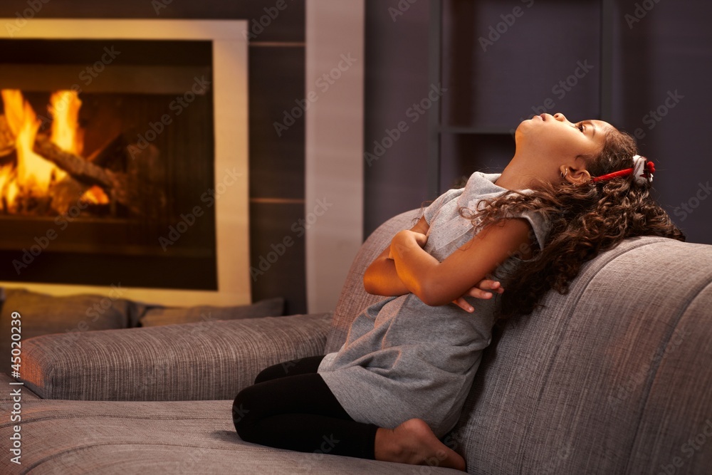 Tableau sur toile Little girl sulking on sofa