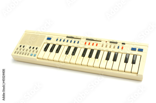 Old Electric piano isolated on white background