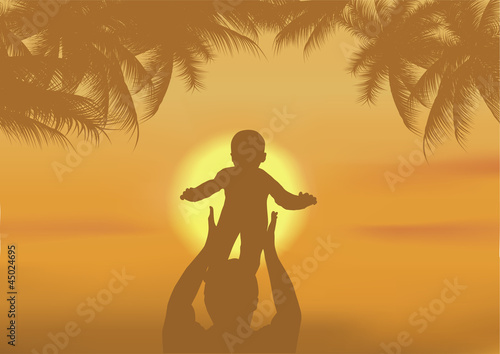 the father and the son playing on a beach