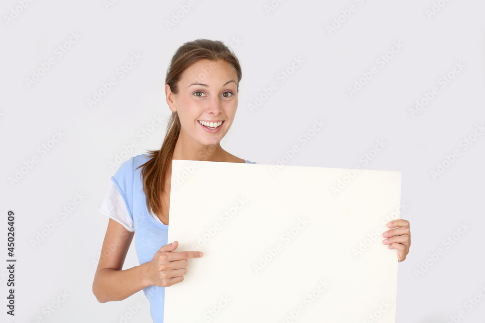 Cheerful young woman holding whiteboard , isolated Cheerful young woman holding whiteboard , isolated